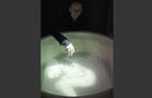 Monika Weiss
White Chalice (Ennoia)
2004
Polypropylene, fiberglass, water, video projection, sound
View of the artist with the installation at the (Un)Scene Art Show, Armory Week, New York, March 2015